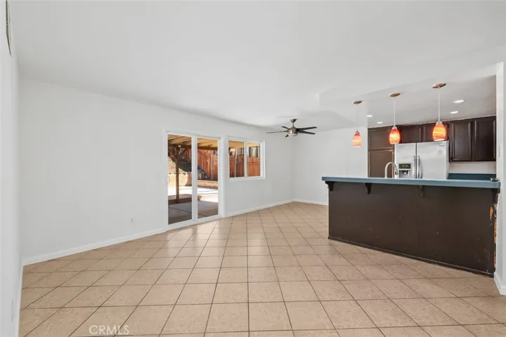 Open living and dining layout provides a seamless connection between main living spaces. The broad floorplan makes the home feel comfortable, functional, and easy to enjoy.
