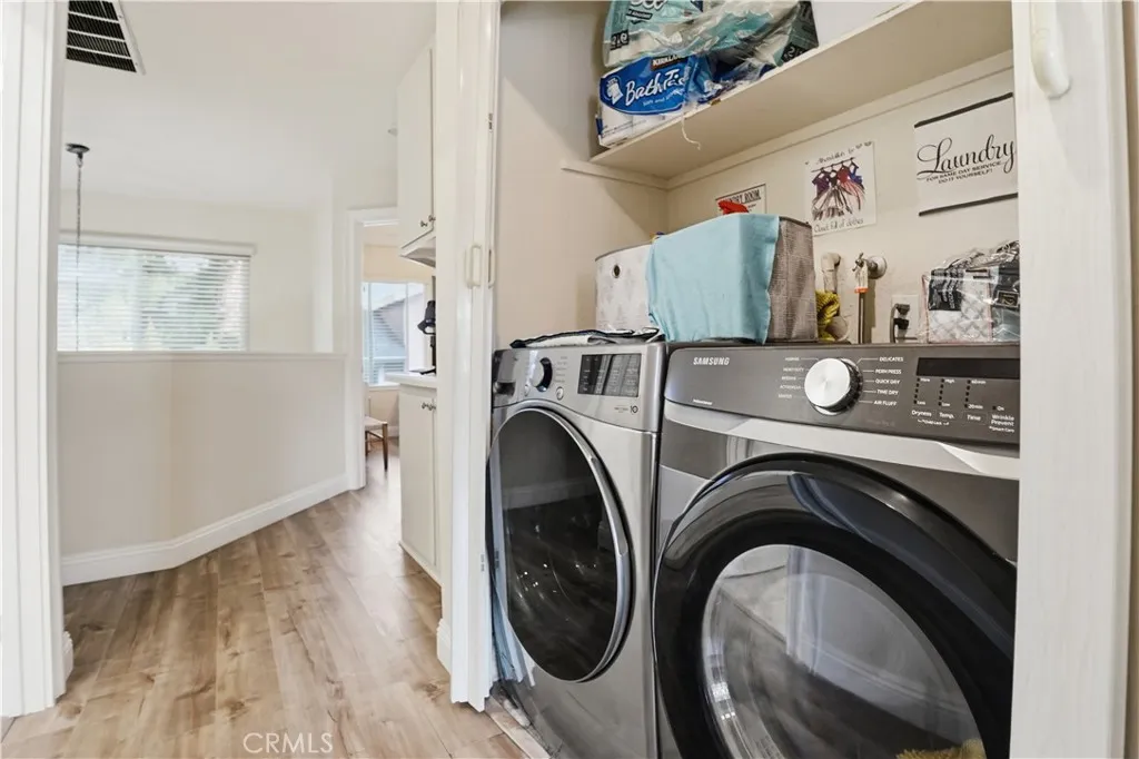 The laundry area is upstairs:  home comes with the washer and dryer!