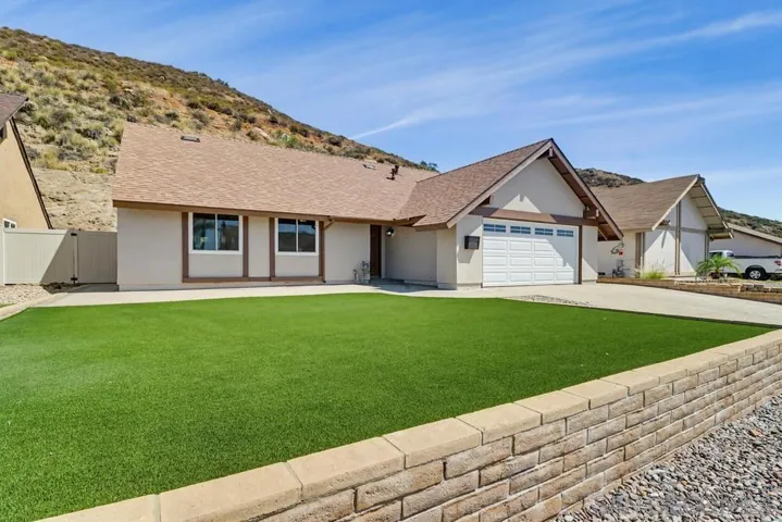 Incredible 4 bedroom/3 bath home nestled in a quiet enclave in Santee!