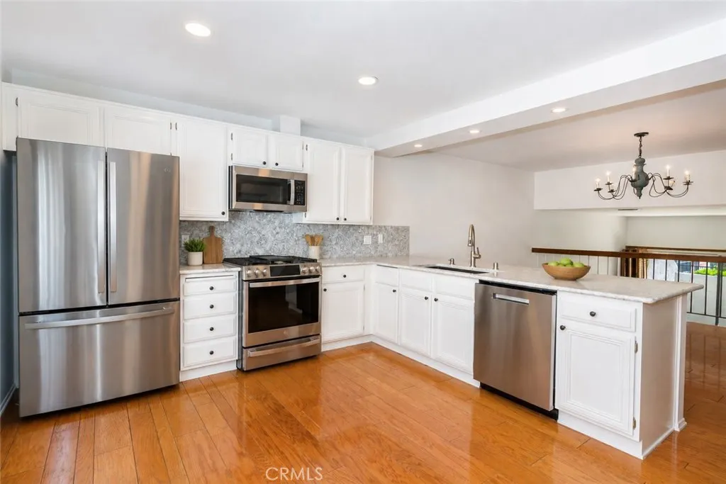 Virtually Staged Digitally altered photo of Kitchen with lovely stone counter tops