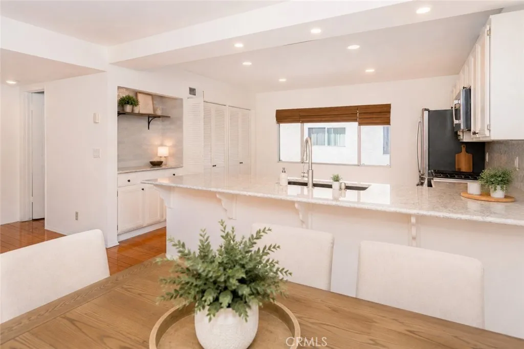 Virtually Staged Digitally altered photo of Kitchen breakfast bar counter top