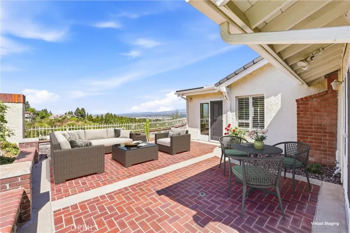 Panoramic view provides a dramatic backdrop for the outdoor living space (virtually staged).