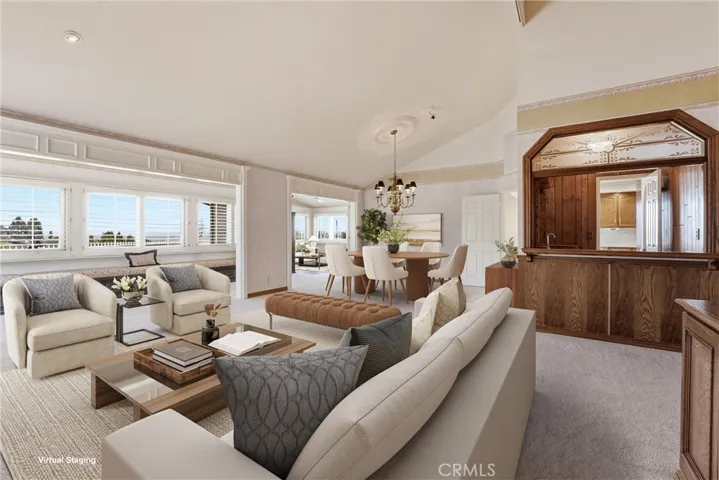 Open and bright living room featuring a stunning panoramic view, showcasing the natural beauty and spaciousness of the property (virtually staged).