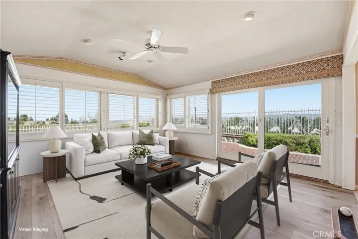 Family room captures the panoramic views (virtually staged)..