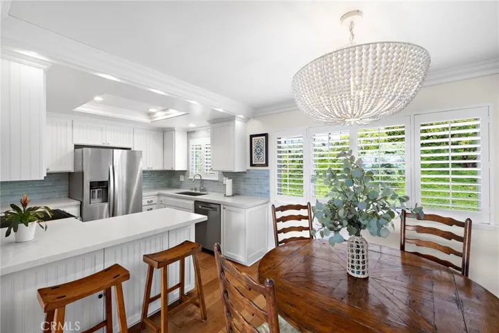 DINING AREA AND BREAKFAST BAR.  ALL NEW KITCHEN APPLIANCES.