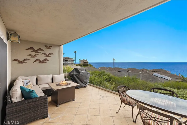 ENJOY OUTDOOR DINING ON GROUND FLOOR PATIO WITH FIREPIT AND BBQ.