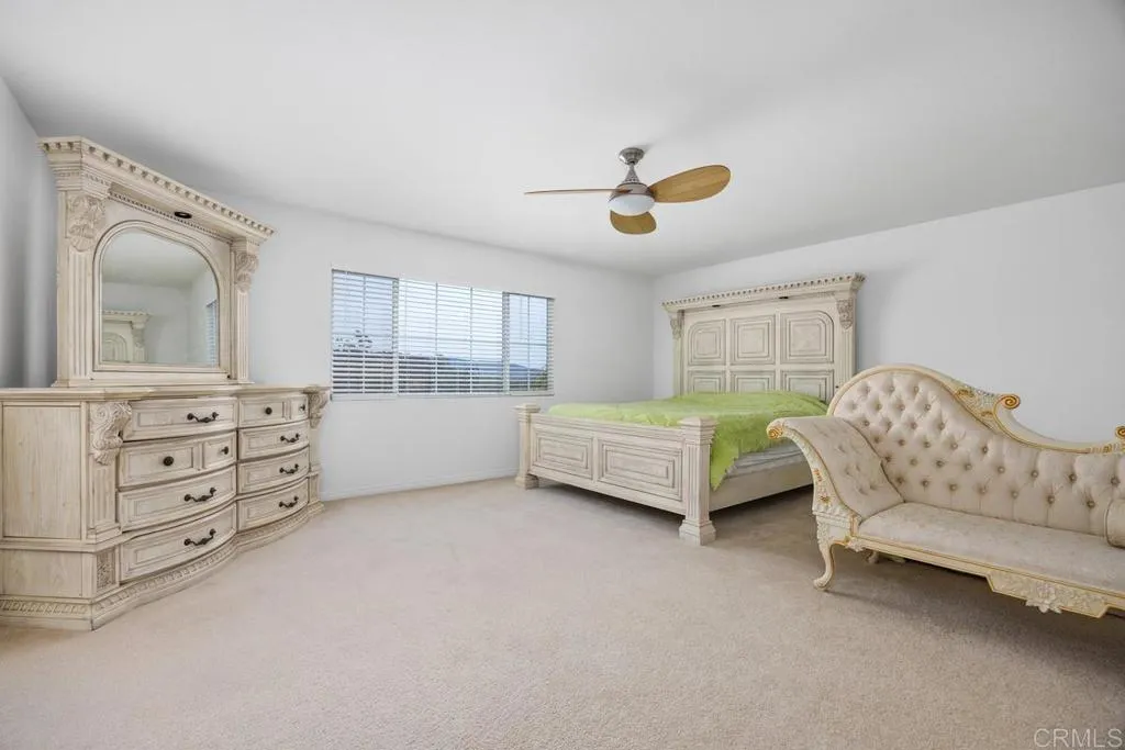 Double doors lead to private primary suite with expansive views