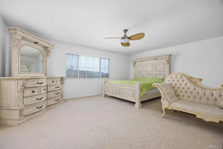 Double doors lead to private primary suite with expansive views