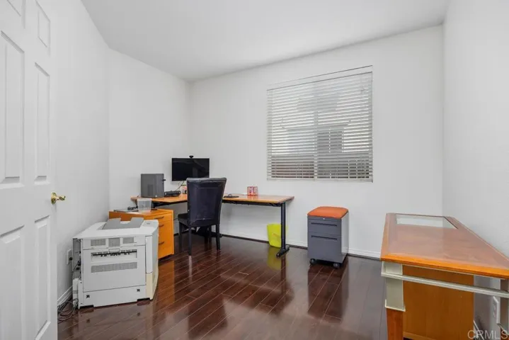 Downstairs optional bedroom #4 adjacent to full bath. Currently office