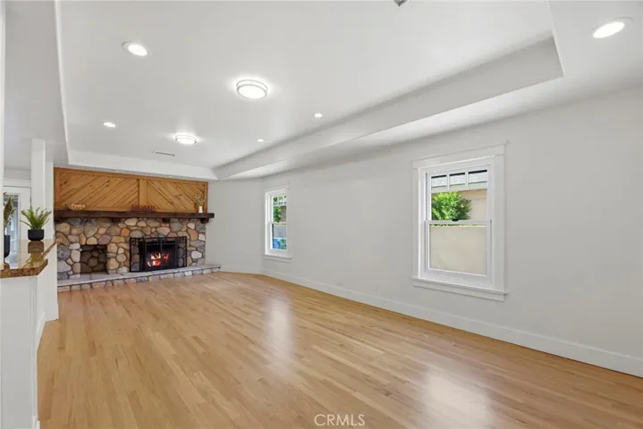 Living Room area wide view show casing dual fireplace