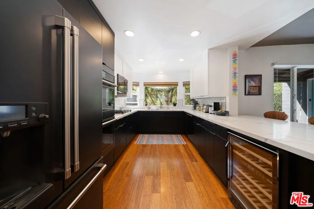 U-shaped kitchen with black ca