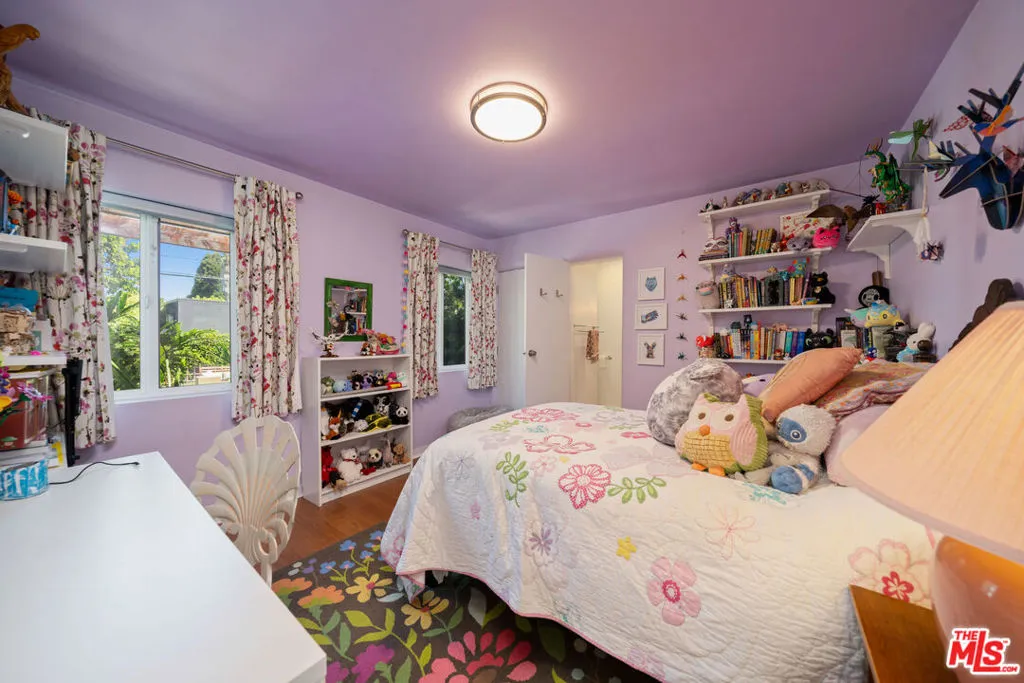 Bedroom featuring purple walls