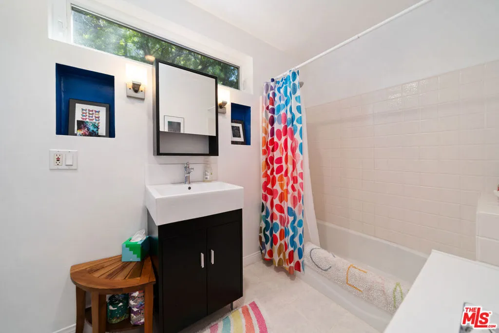 Bathroom with a black vanity,