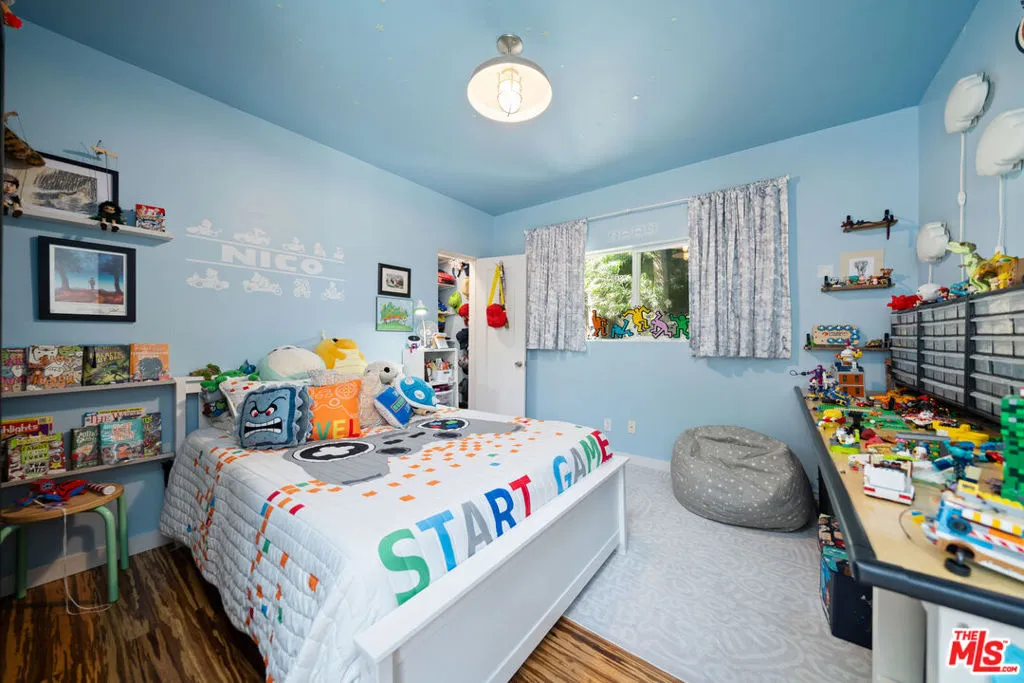 Bedroom with light blue walls,