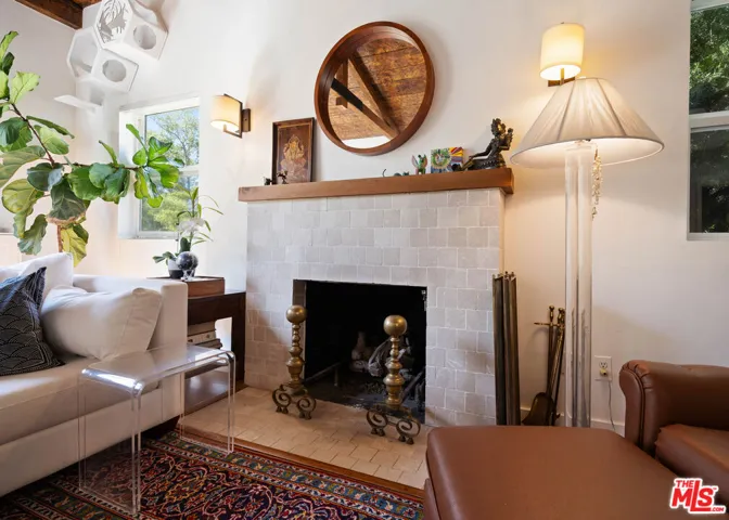 Tiled fireplace with a wood ma