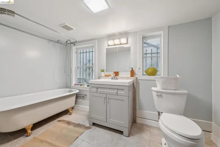 Lower level apartment bathroom features an original claw foot tub.