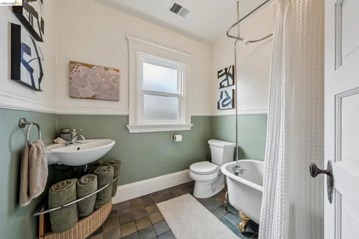Beautifully updated full bathroom with a claw foot tub.