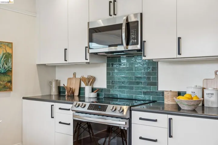 Kitchen features stylish backsplash tile.