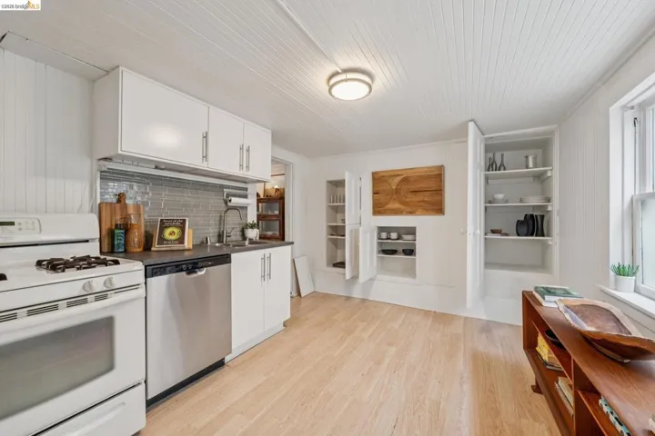Lower unit kitchen with original built-in cupboards.