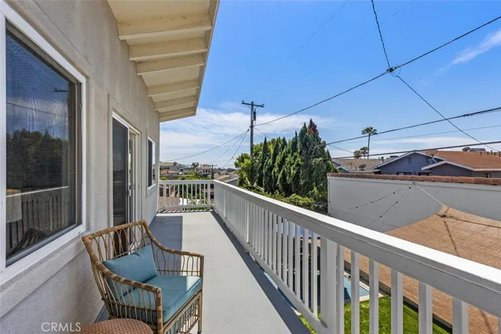 This deck runs the full width of the back of the house.