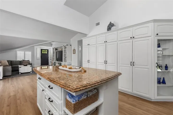 The large cabinet to the right has pull out shelving for your convenience :)