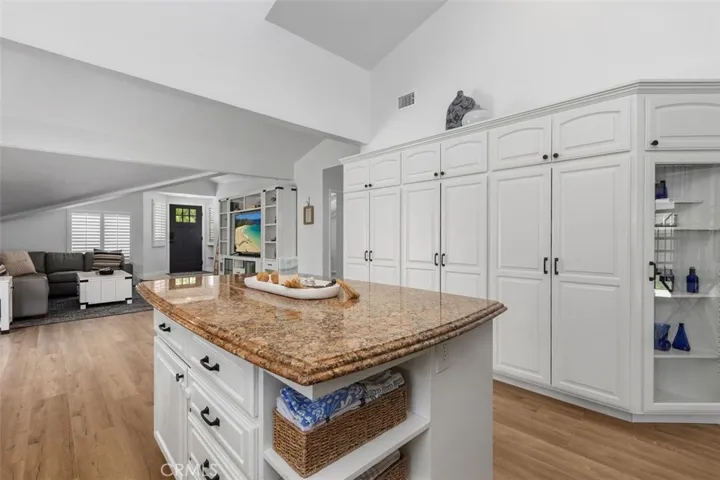 Built in cabinetry with glass doors adds a designer touch.