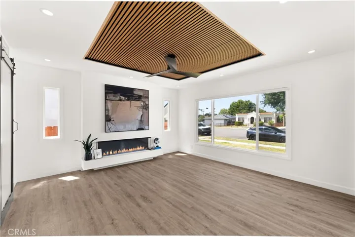 Welcoming living room view centered around cozy fireplace