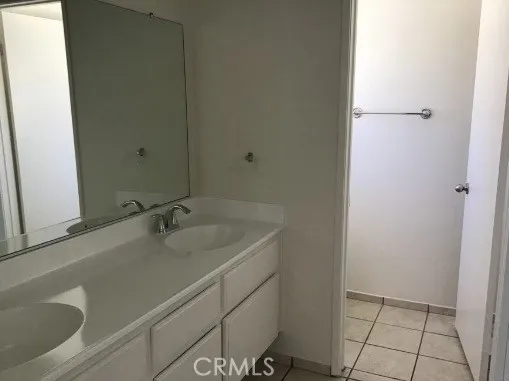 Ensuite has double sinks and separate water closet