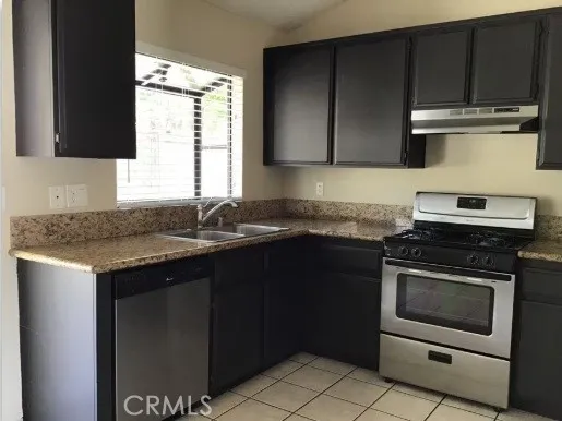 Garden window over the sink provides wide view of back yard
