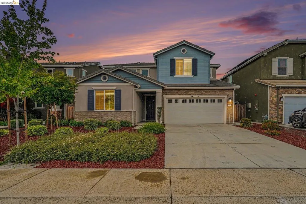 Two-story residence featuring a two-car garage and a concrete driveway