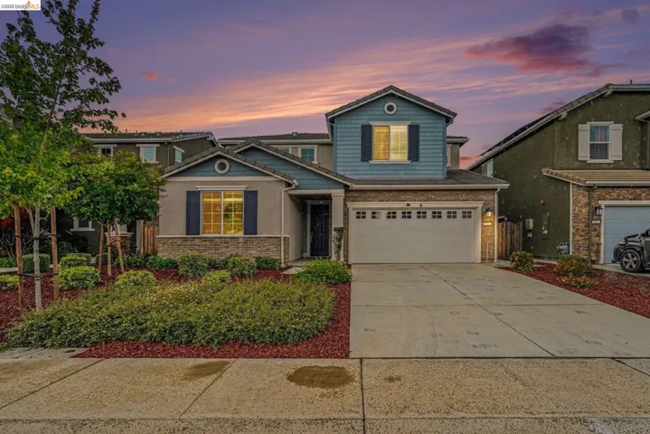 Two-story residence featuring a two-car garage and a concrete driveway
