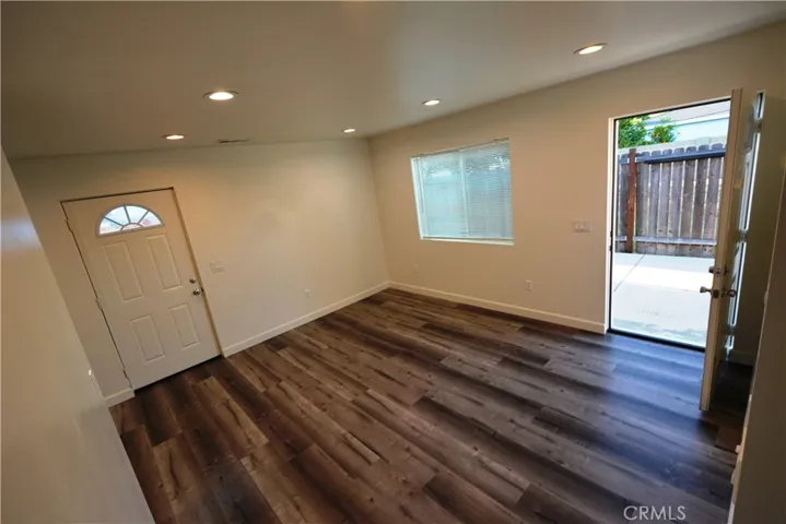 Notice the LED lights, laminate flooring and spacious living room area