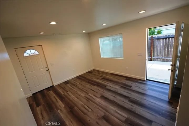 Notice the LED lights, laminate flooring and spacious living room area