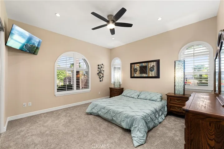 Bedroom #1 with Front of House Views, Ceiling Fan and Shutters