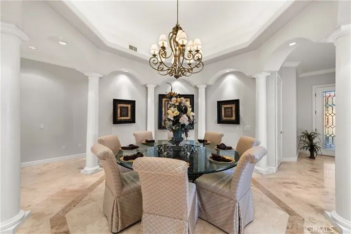 Amazing Dining Area with Statement Lighting on Dimmers and Recessed Lighting