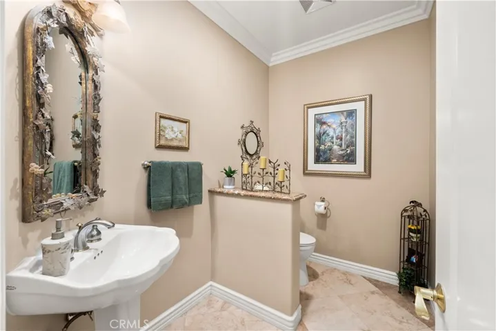 Beautiful Hall Half Bathroom with Privacy Wall and Storage