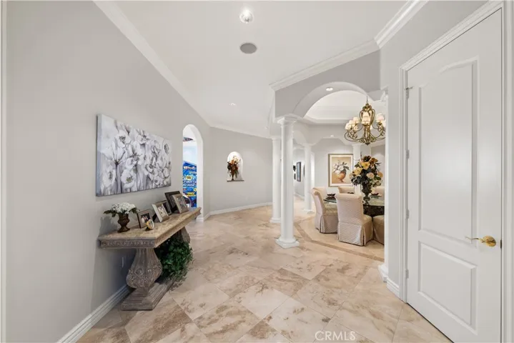 Beautiful Front Entry with Travertine Flooring Throughout.