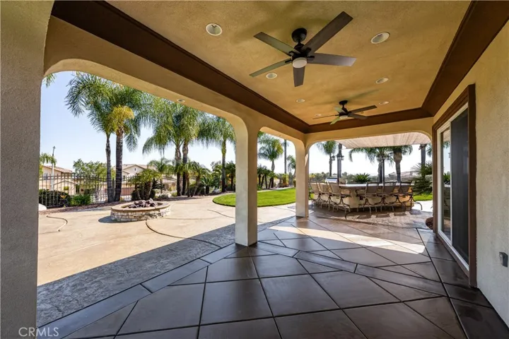 Patio Cover with Dual Ceiling Fan, Recessed Lighting with Sliding Door to Game Room