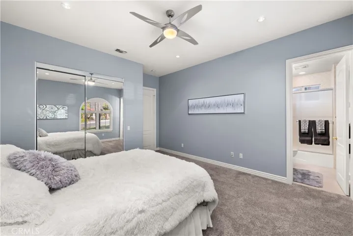 Bedroom #2 with Mirrored Closet Doors, Ceiling Fan and Shutters