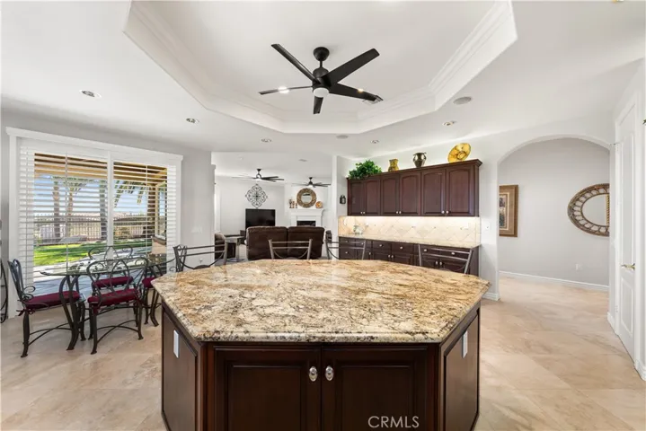Large Kitchen Island with a Vast Amount of Storage Showing the Breakfast Area