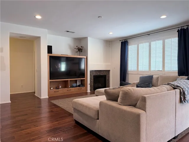 View from kitchen into family room. Note the gas fireplace, and entertainment niche
