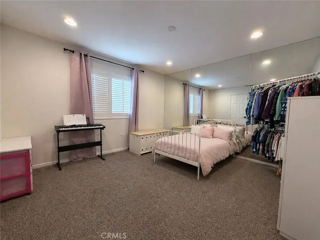 Nursery/office/workout room with door to the upstairs hallway as well as double doors to primary suite bathroom Could be used as a massive storage/closet overflow room too
