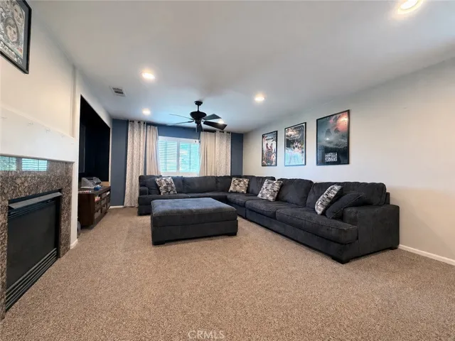 Large loft at top of stairs with gas fireplace