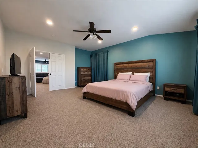 Primary bedroom with main doors to the loft area