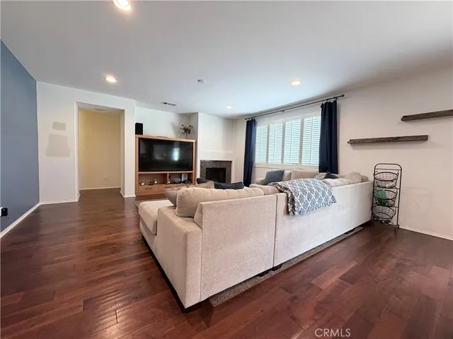 View from kitchen into family room. Note the gas fireplace, and entertainment niche