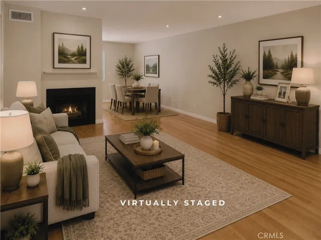 Virtually Staged Living Room - Digitally enhanced to depict fireplace flames.