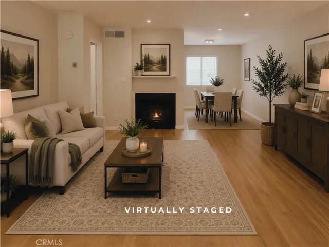 Virtually Staged Living Room Dining Room - Digitally enhanced to depict fireplace flames.