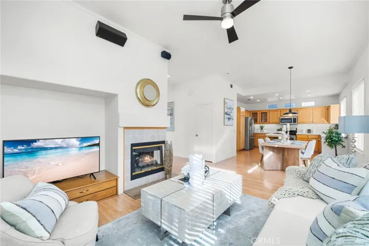 Family Room has Media Niche and Tiled Gas-Log Fireplace