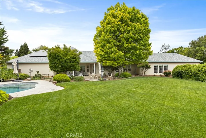 Backyard with mature landscaping on the large lot