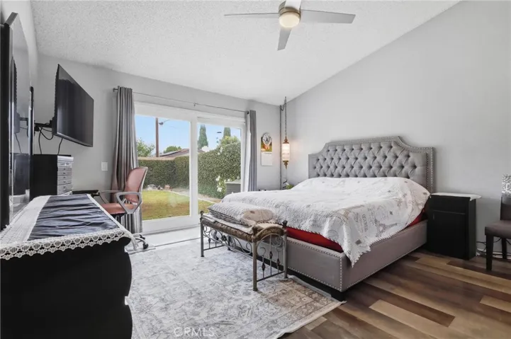 Main bedroom with slider doors to back yard